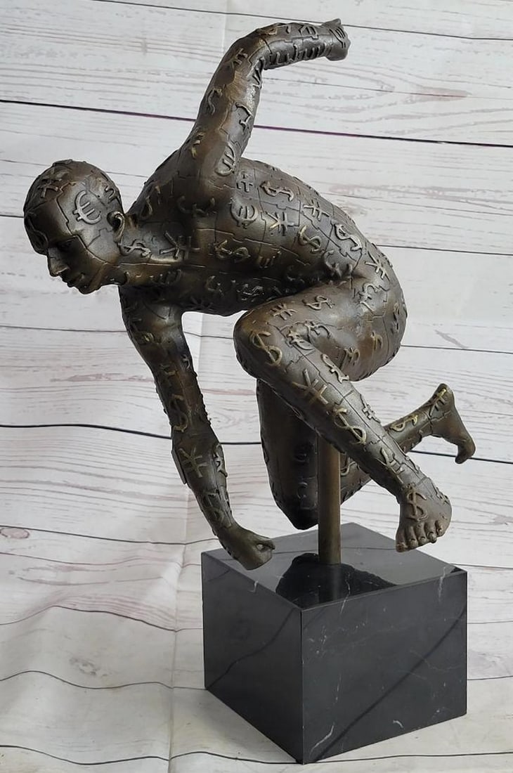 Man Ready For Race Bronze Sculpture On Marble Base - 17" x 17": Man Ready For Race Bronze Sculpture On Marble Base - 17" x 17" This abstract is a very odd and creative one, we guarantee you that you will have people talking about it. You can tell its a fig