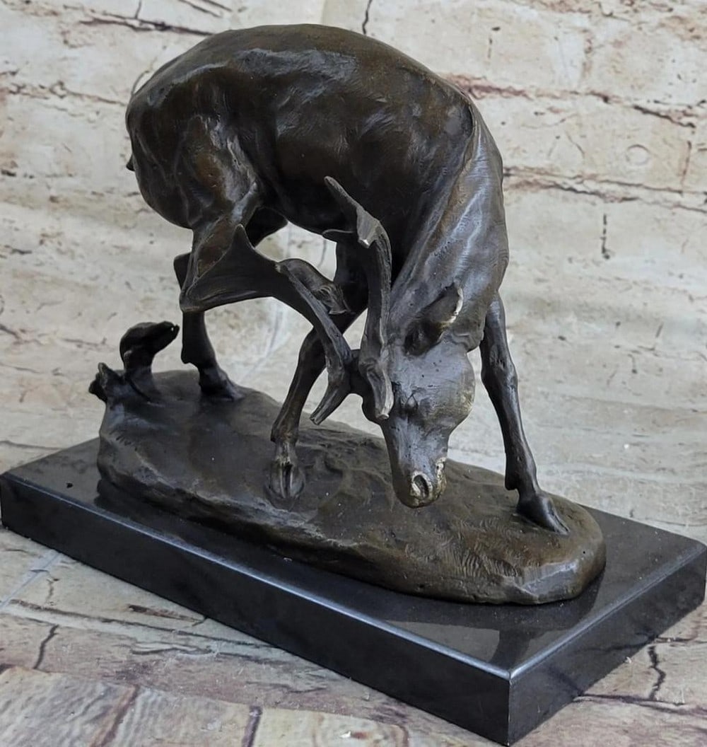 White Tail Buck Original Bronze Statue - 8" x 8.5": White Tail Buck Original Bronze Statue - 8" x 8.5" The sculpture captures the serene grace of the buck in a naturalistic pose, with meticulous attention to the fur and antlers' fine details. M