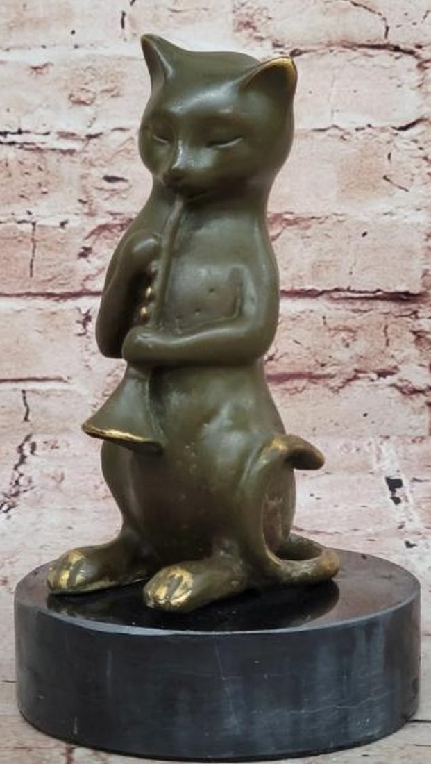 Melody in Whiskers Bronze Sculpture: Melody in Whiskers Bronze Sculpture Full of charm and character, this whimsical bronze sculpture features a playful cat caught mid-performance, skillfully playing a clarinet with delightful poise. Wit