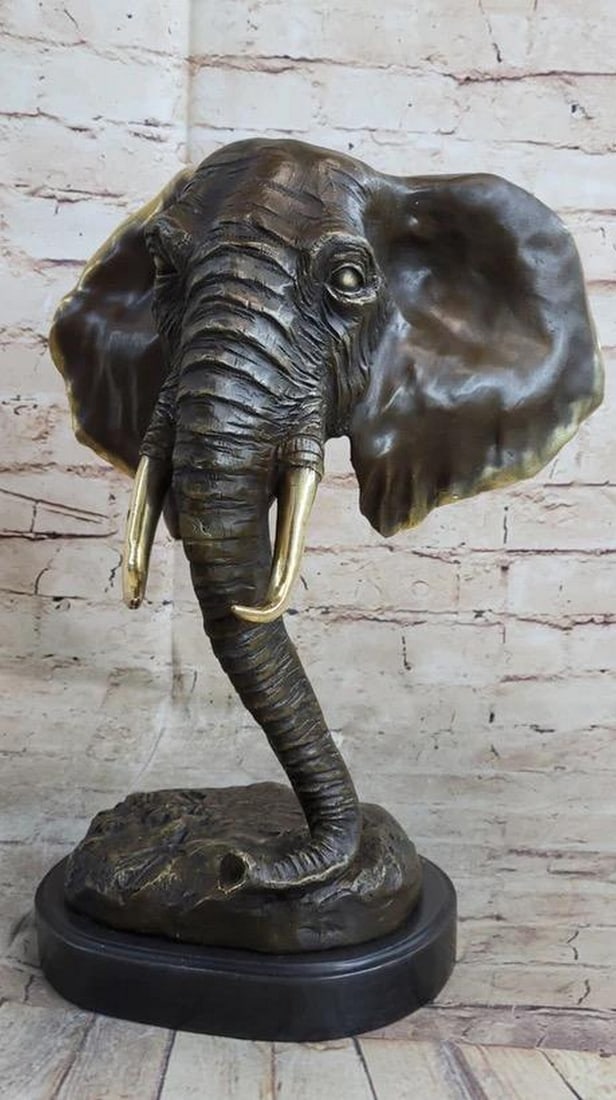 Bronze Bust Statue of Wild African Elephant - 15" x 10": Bronze Bust Statue of Wild African Elephant - 15" x 10" This exquisite bronze sculpture expertly captures the majestic presence of an elephant, highlighting its commanding head and distinctive
