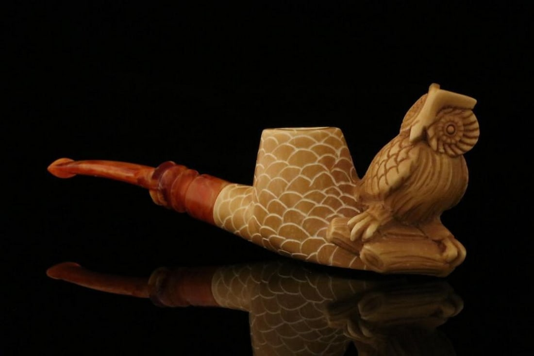 Owl Self-Sitter Carved Meerschaum Pipe with Fitted Case: Owl Self-Sitter Carved Meerschaum Pipe with Fitted Case This hand-carved meerschaum pipe features an owl design with a self-sitting base, allowing it to stand upright on its own. The piece highlights