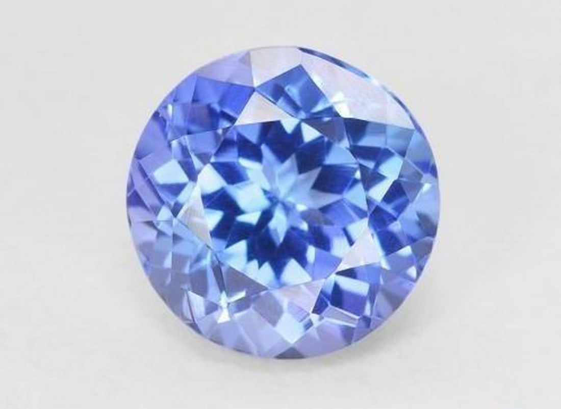 1.65ct Round Cut Deep Violet Blue Tanzanite: 1.65ct Round Cut Deep Violet Blue Tanzanite This exquisite 1.65-carat tanzanite features a 7 mm round cut with vivid deep violet-blue color and VVS clarity, enhanced through expert heating. Sourced