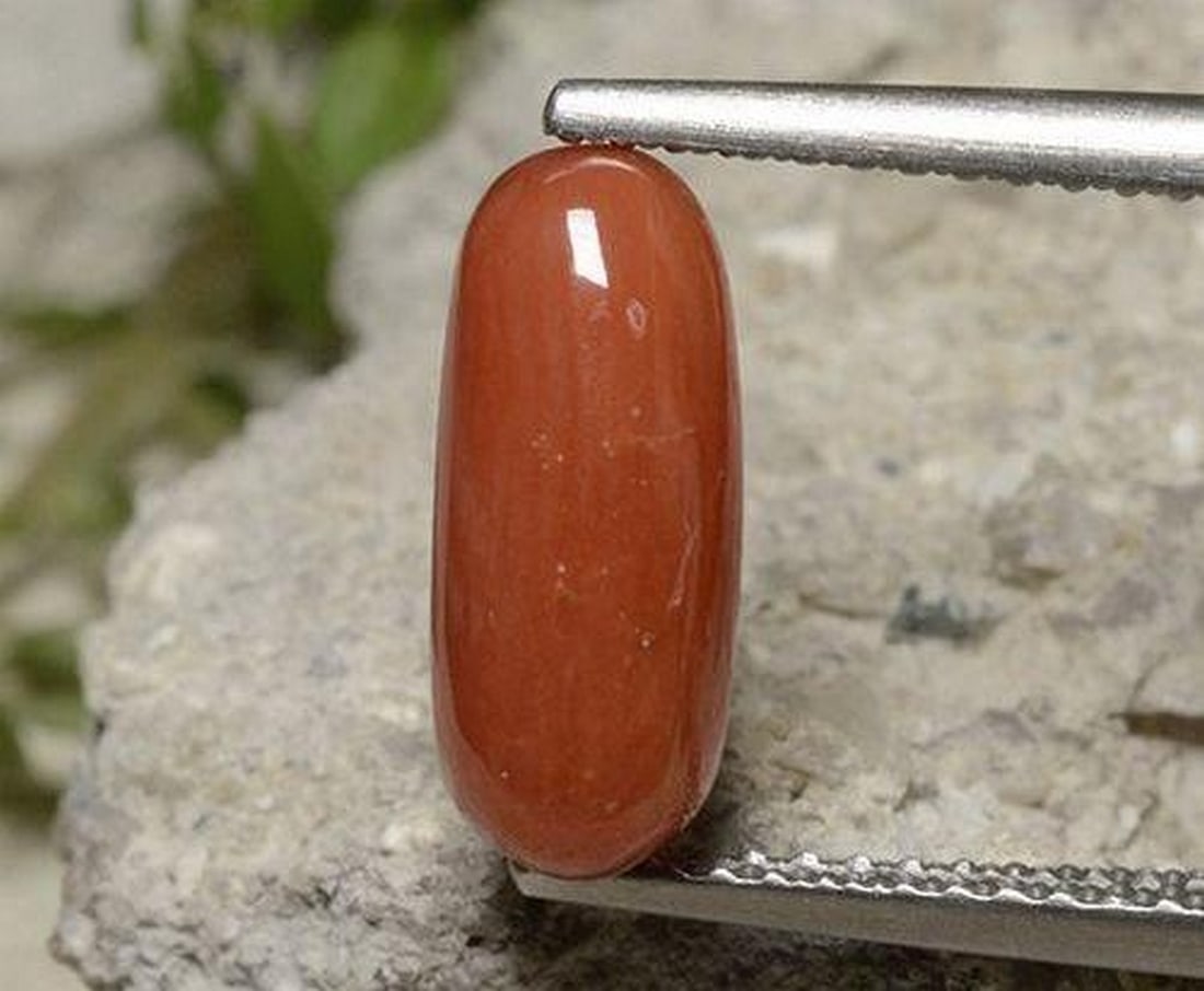 2.11ct Natural Light Red Coral, Oval Cabochon, Opaque, Australia: 2.11ct Natural Light Red Coral, Oval Cabochon, Opaque, Australia Natural coral gemstone weighing 2.11 carats, cut in an oval cabochon shape with a light red color and opaque clarity. The gem measures