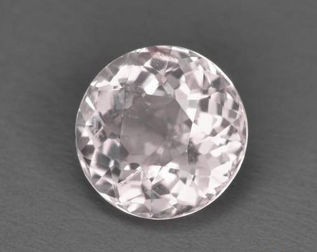 1.52ct Natural Light Pink Morganite, Round, VS: 1.52ct Natural Light Pink Morganite, Round, VS A natural morganite weighing 1.52 carats, cut into a perfectly calibrated 7.5 mm round facet. This gem displays a delicate light pink color with VS clari