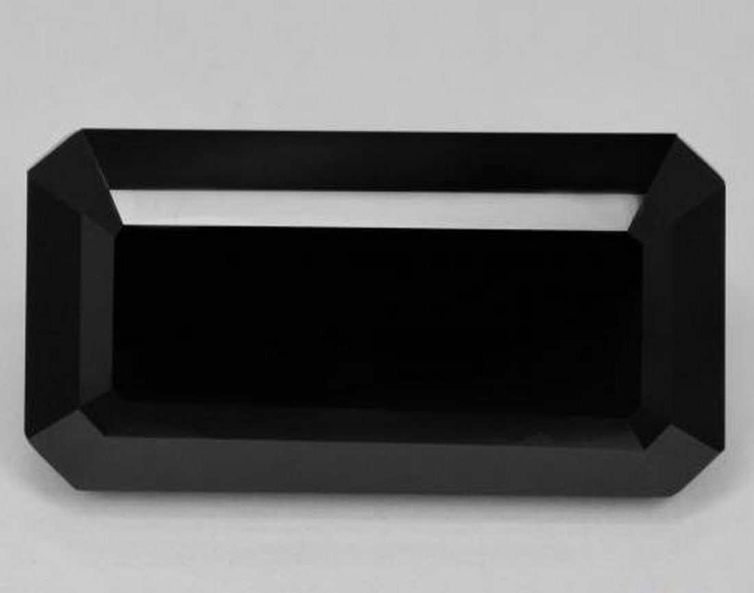 38.28ct Natural Schorl Tourmaline, Octagon / Emerald Cut, Opaque: 38.28ct Natural Schorl Tourmaline, Octagon / Emerald Cut, Opaque A natural black (schorl) tourmaline gemstone weighing 38.28 carats, cut in an octagon/emerald step shape with an opaque black color. Th