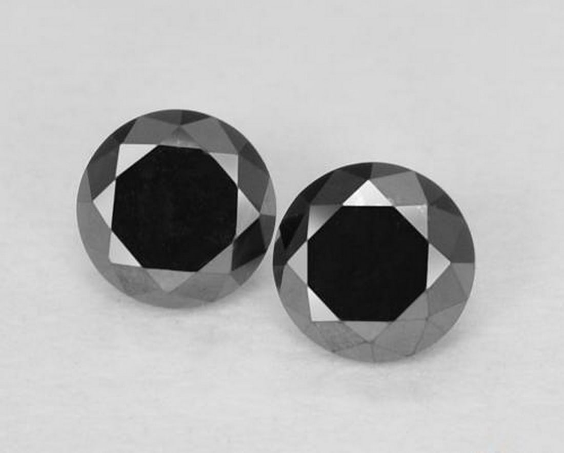 0.27ct Natural Black Diamond Gems, Round, Opaque: 0.27ct Natural Black Diamond Gems, Round, Opaque Pair of natural black diamond gemstones with a combined weight of 0.27 carats (average 0.14 carats each), cut in a round diamond-cut facet with opaque 