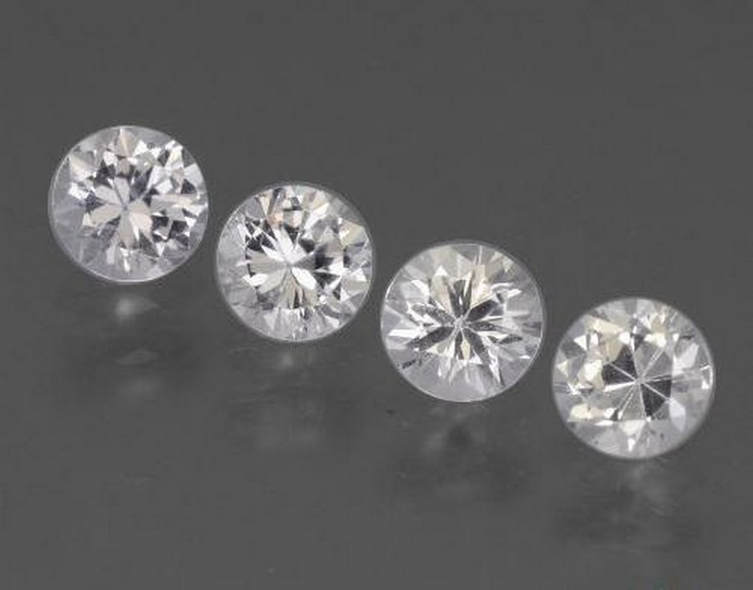1.60ct Natural White Sapphire, Round, VVS-VS (Set of 4): 1.60ct Natural White Sapphire, Round, VVS-VS (Set of 4) Set of four natural white sapphire gemstones with a combined weight of 1.60 carats (average 0.40 carats each), cut in a round diamond-cut facet 