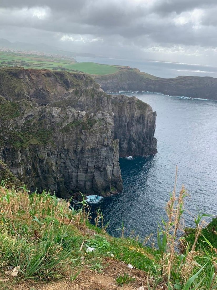Misty Cliffside Vista: Misty Cliffside Vista Capture the dramatic beauty of a coastal landscape with this exclusive hand-painted canvas opportunity. The photograph showcases a cliffside view where the ocean stretches below 