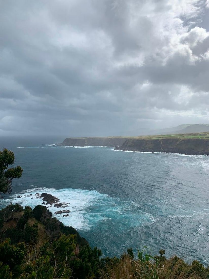 Ocean's Edge: Ocean's Edge Immerse yourself in the rugged beauty of the coastline with this hand-painted canvas opportunity. The photograph captures the view from a cliffside, looking down at jagged rocks below