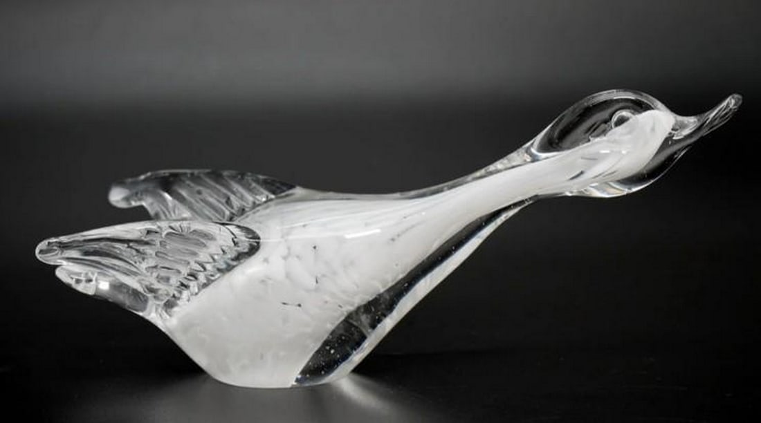 Murano Glass Duck in Flight: Murano Glass Duck in Flight Graceful and dynamic, this Murano glass flying duck captures the essence of movement in mid-flight. Hand-blown by skilled artisans, the figurine features fluid lines and