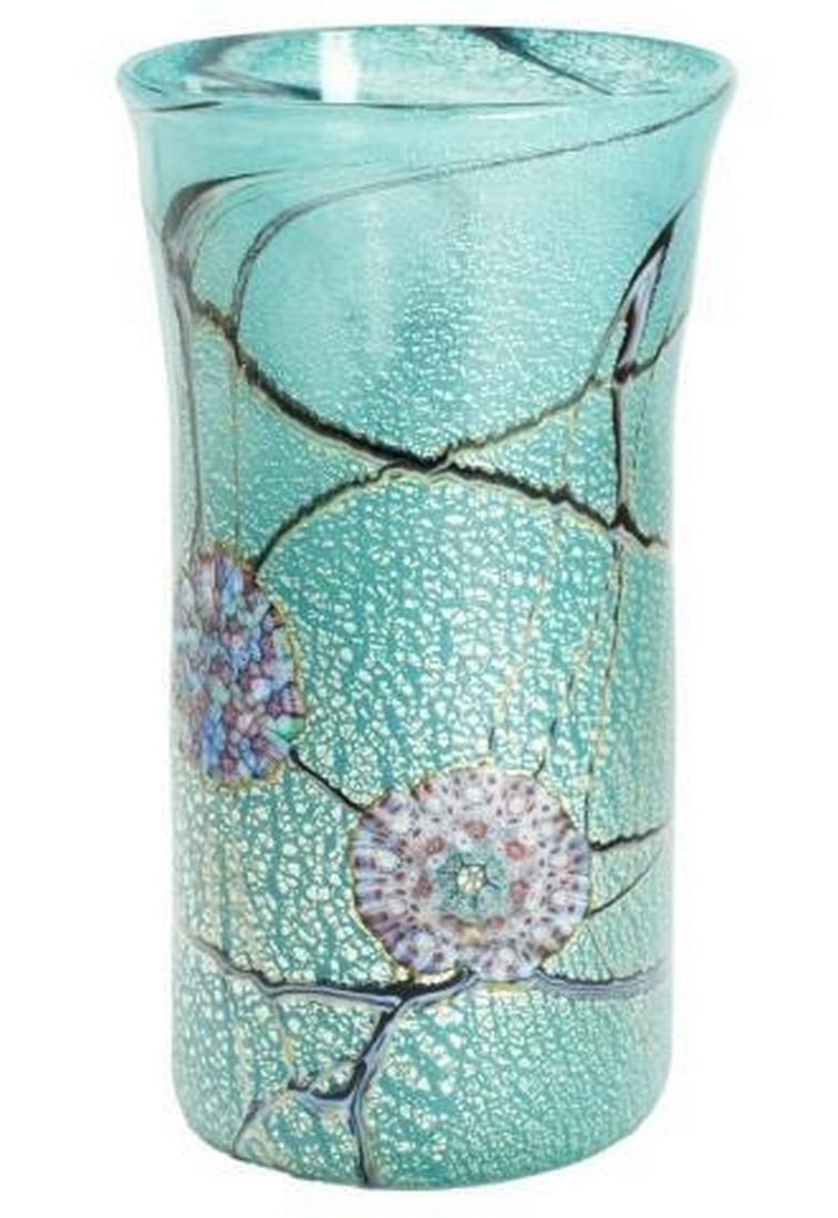 Aquamarine Murrine Vase with Silver Abstract Murano Glass Art: Aquamarine Murrine Vase with Silver Abstract Murano Glass Art This captivating Murano glass vase blends shimmering aquamarine tones with embedded silver foil and intricate murrine details, forming an