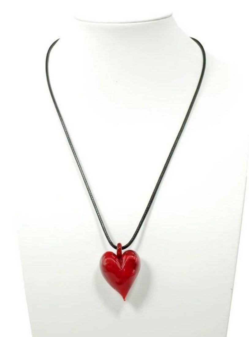 Murano Glass Heart Pendant: Murano Glass Heart Pendant Handcrafted with care on Murano Island, this heart-shaped pendant captures the charm of traditional Venetian glassmaking. The smooth, luminous surface reflects light with