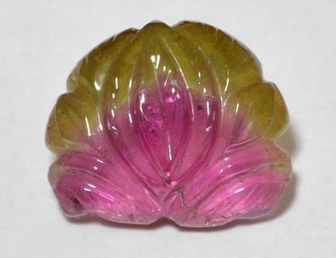 Watermelon Tourmaline Carved Leaf Gemstone: Watermelon Tourmaline Carved Leaf Gemstone This exquisite loose gemstone is carved into a delicate leaf from natural bi-color tourmaline, displaying a beautiful blend of pink and green tones
