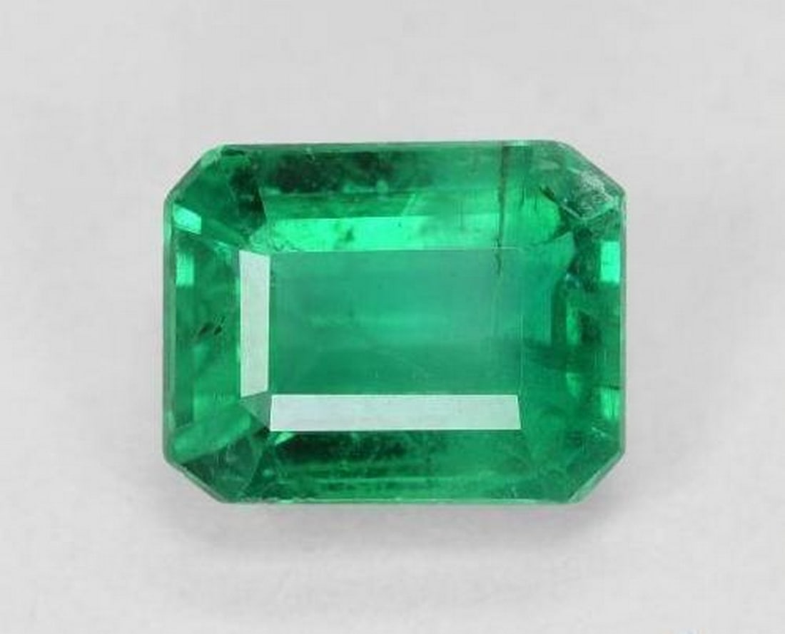 2.08ct Octagon Step Cut Deep Green Emerald: 2.08ct Octagon Step Cut Deep Green Emerald A rich medium emerald green, octagon step-cut emerald weighing 2.08 ct with SI clarity, oiled to enhance its natural color. Hailing from Zambia, this gem is 