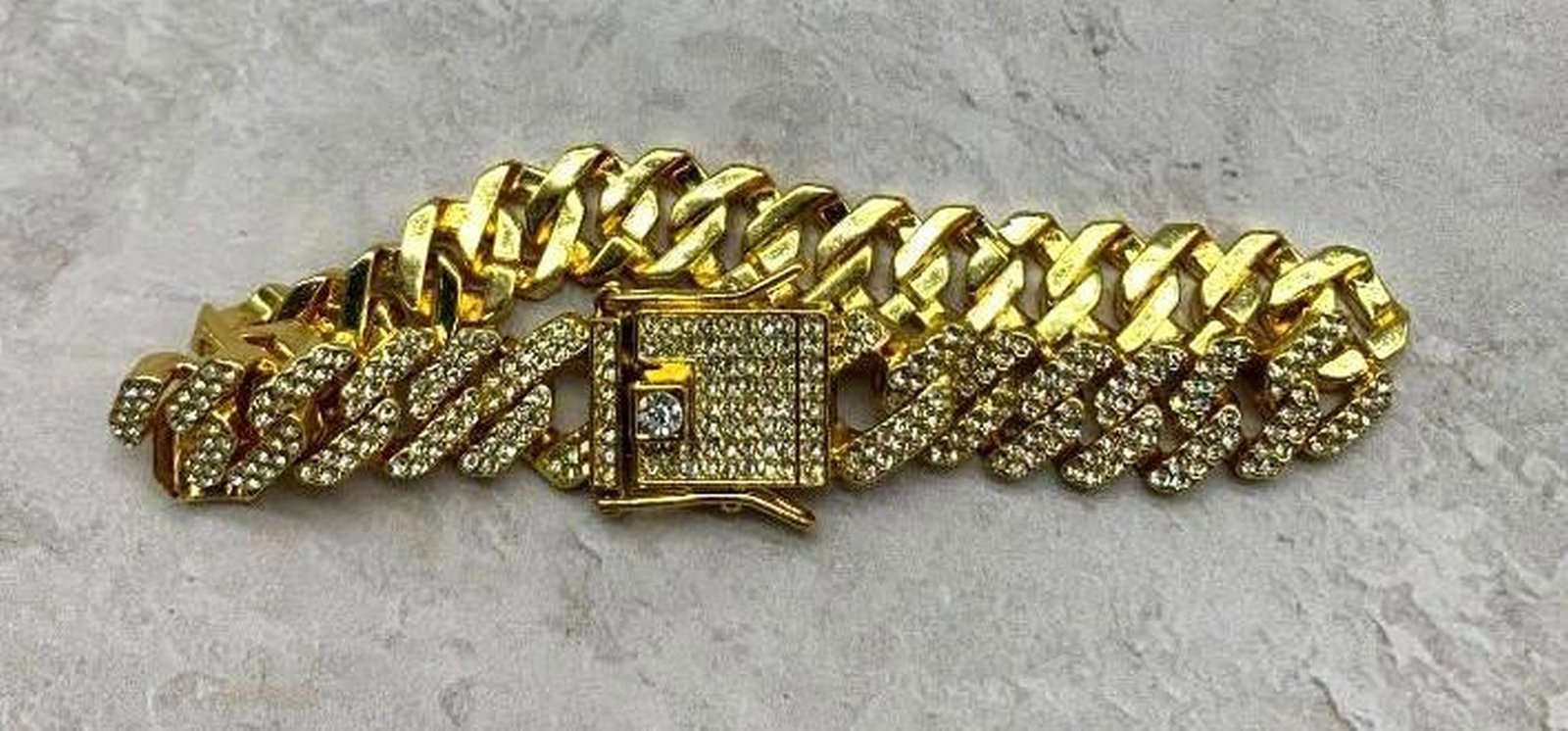 Gold Plated Rhinestone Accent Bracelet: Gold Plated Rhinestone Accent Bracelet Add a touch of glamour to your wrist with this stunning gold plated bracelet, beautifully adorned with shimmering rhinestones along the front. The sleek, polishe