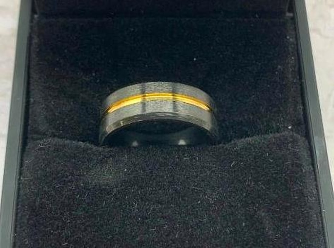 Black Titanium Steel Ring: Black Titanium Steel Ring Sleek, modern, and built to last, this black titanium steel ring features a striking gold-tone indented circle that wraps cleanly around the center. The contrast between the 
