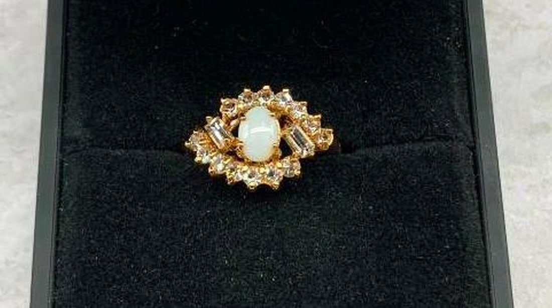 Refined Woven Basket Style Ring with Opal Gem: Refined Woven Basket Style Ring with Opal Gem Refined and gracefully detailed, this ring features a luminous white opal gemstone cradled in an intricately woven basket setting. The shimmering opal