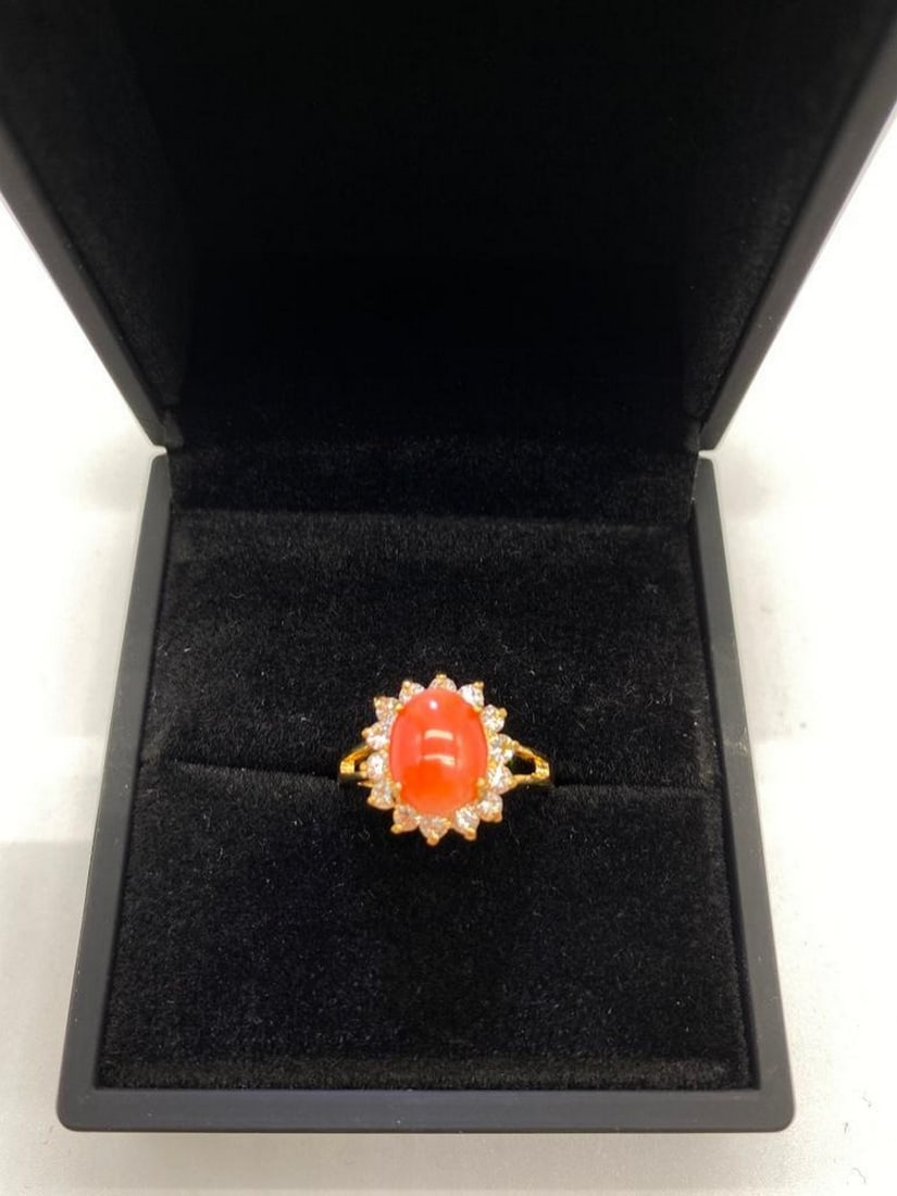 Striking Halo Setting Coral Stone and Swarovski Crystal, Yellow Gold Ring: Striking Halo Setting Coral Stone and Swarovski Crystal, Yellow Gold Ring An impressive Coral stone surrounded by Swarovski crystals on a Yellow Gold band. Made in Israel. Genuine Natural High Quality