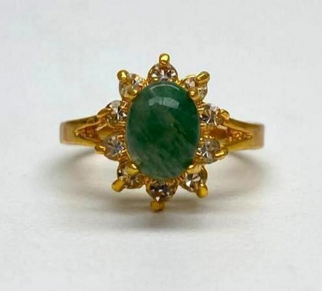 One of a Kind Jade and Austrian Crystal Gemstone Ring: One of a Kind Jade and Austrian Crystal Gemstone Ring. Distinctive and unique green Jade stone surrounded by Austrian crystals on a 18KTGP Band.Green Jade is believed to improve kidney and heart