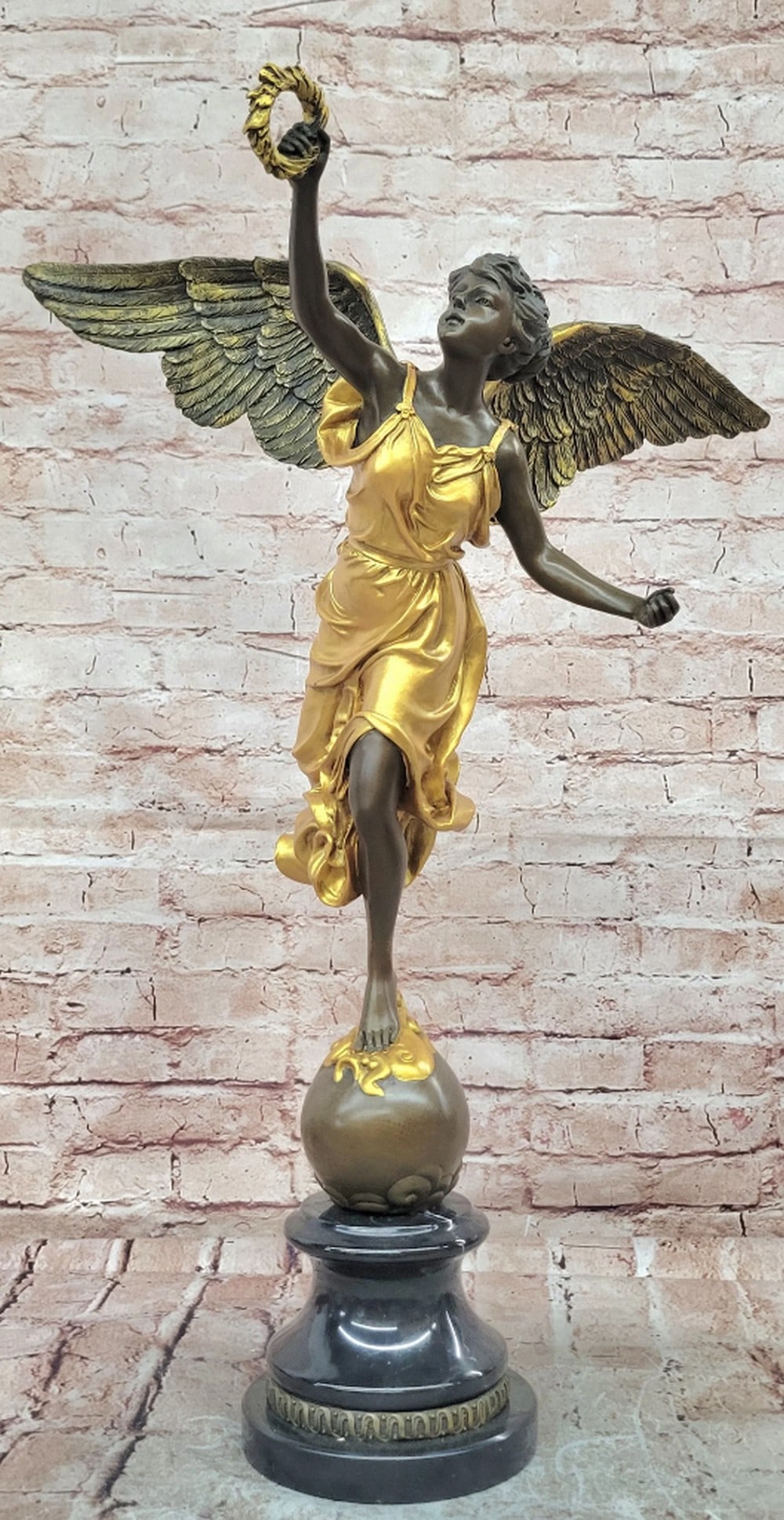 Bronze Sculpture of the Greek Goddess of Victory on Marble Base - 24.5" x 16.5": Bronze Sculpture of the Greek Goddess of Victory on Marble Base - 24.5" x 16.5" Introducing a Bronze Sculpture: This depiction of the Greek Goddess of Victory is handcrafted with attention to 