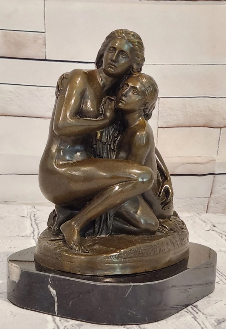 Mother and Daughter Bronze Sculpture by Cesaro - 8.5" x 7": Mother and Daughter Bronze Sculpture by Cesaro - 8.5" x 7" Introducing a Bronze Sculpture: This depiction of a mother and daughter is handcrafted with attention to detail. The figures are show