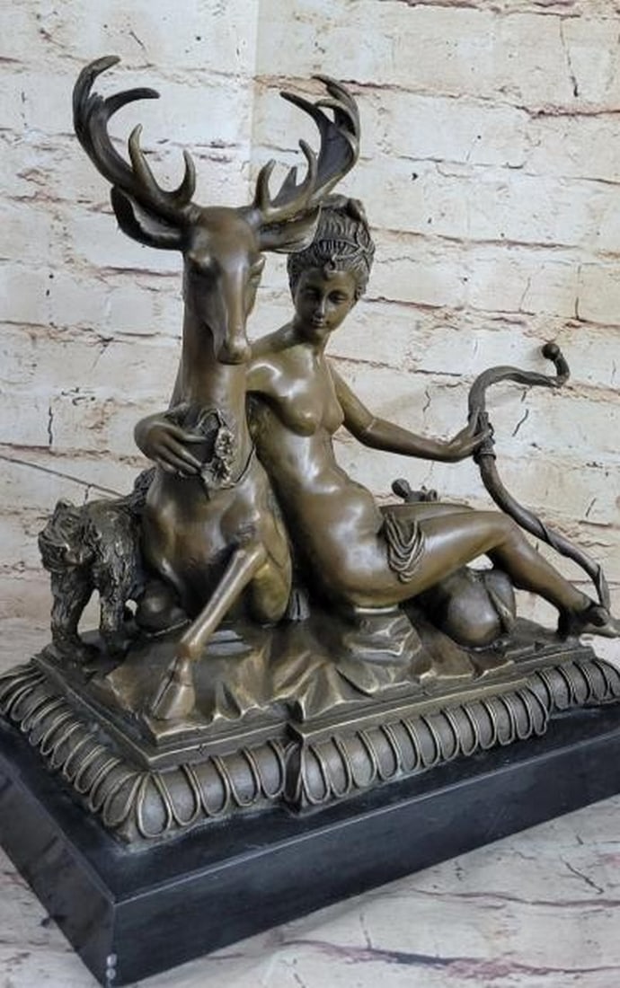 Artemis: Nude Greek Goddess Bronze Sculpture: Artemis: Nude Greek Goddess Bronze Sculpture This exquisite bronze sculpture portrays Artemis, the revered Greek goddess of the hunt, in a serene and intimate moment. Nude and seated gracefully, she h