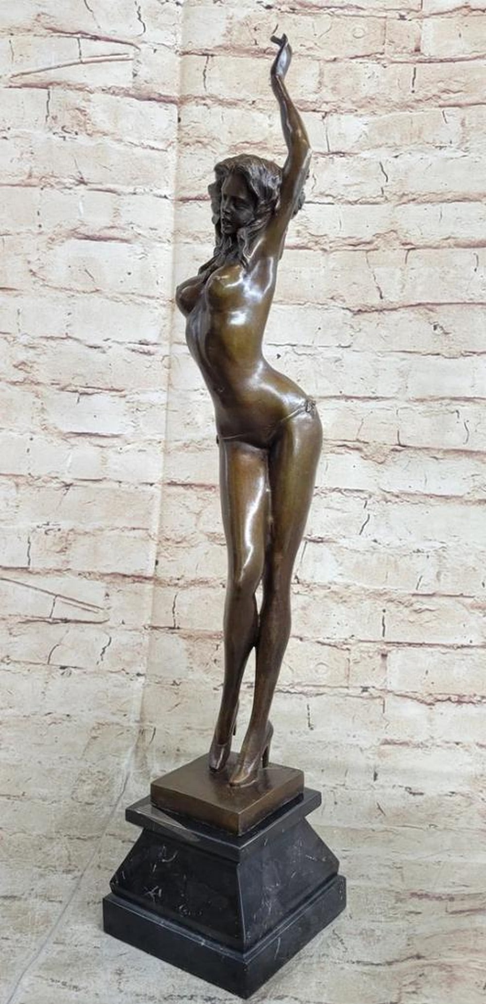 Tempting Form Alluring Nude Woman Bronze Sculpture: Tempting Form Alluring Nude Woman Bronze Sculpture Boldly sensual and confidently poised, this bronze metal sculpture features a nude female figure standing tall with both hands stretched elegantly ab