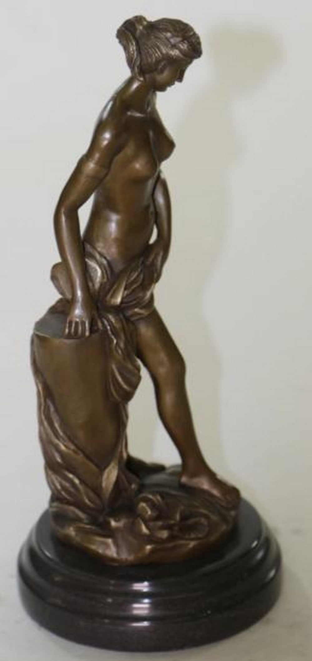 Veiled Venus Nude Bronze Sculpture: Veiled Venus Nude Bronze Sculpture Elegant and timeless, this bronze sculpture captures the goddess Venus in a graceful Art Deco/Nouveau interpretation. Standing nude, the figure partially veils herse