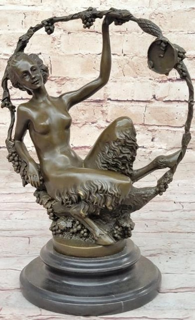 Enchanted Repose: Nude Female Faun in Wreath of Vines Bronze Sculpture: Enchanted Repose: Nude Female Faun in Wreath of Vines Bronze Sculpture Mystical and alluring, this reproduction bronze sculpture features a nude female faun gracefully seated beneath a circular wreath
