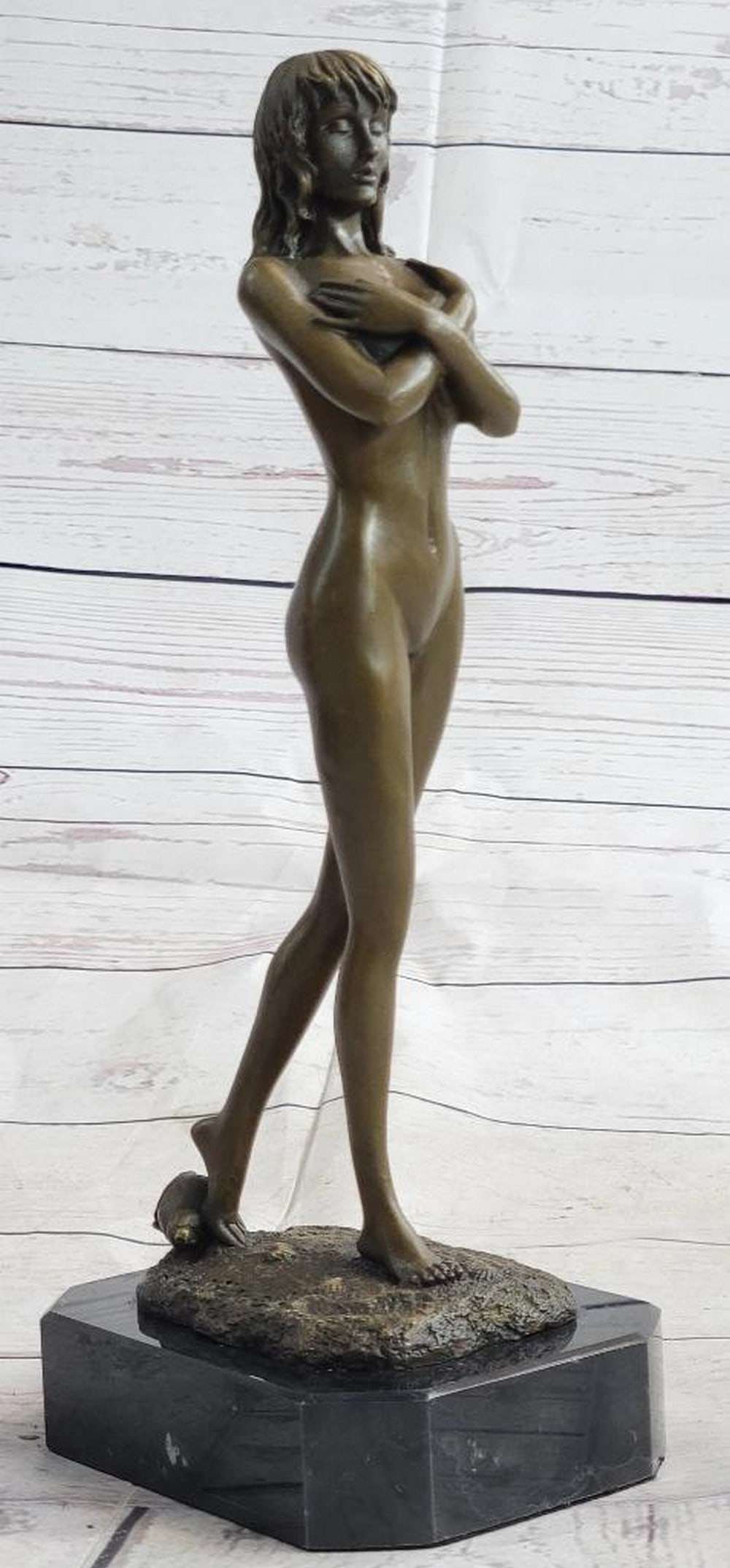 Shy Girl Bronze Sculpture - 11" x 5": Shy Girl Bronze Sculpture - 11" x 5" A beautifully understated celebration of femininity and self-love, this elegant bronze sculpture captures a nude woman in a tender, introspective pose as s