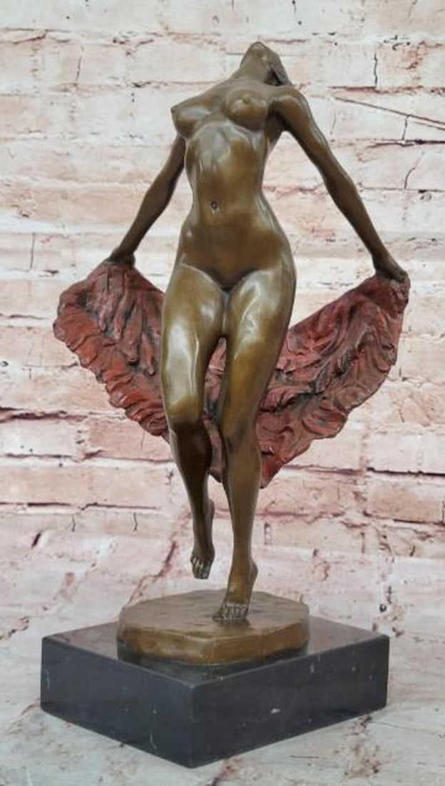 Sensual Grace: Bronze Sculpture of Nude Woman: Sensual Grace: Bronze Sculpture of Nude Woman A stunning celebration of movement and sensuality, this bronze sculpture captures a nude woman in a dynamic pose of expressive elegance. With her back gra