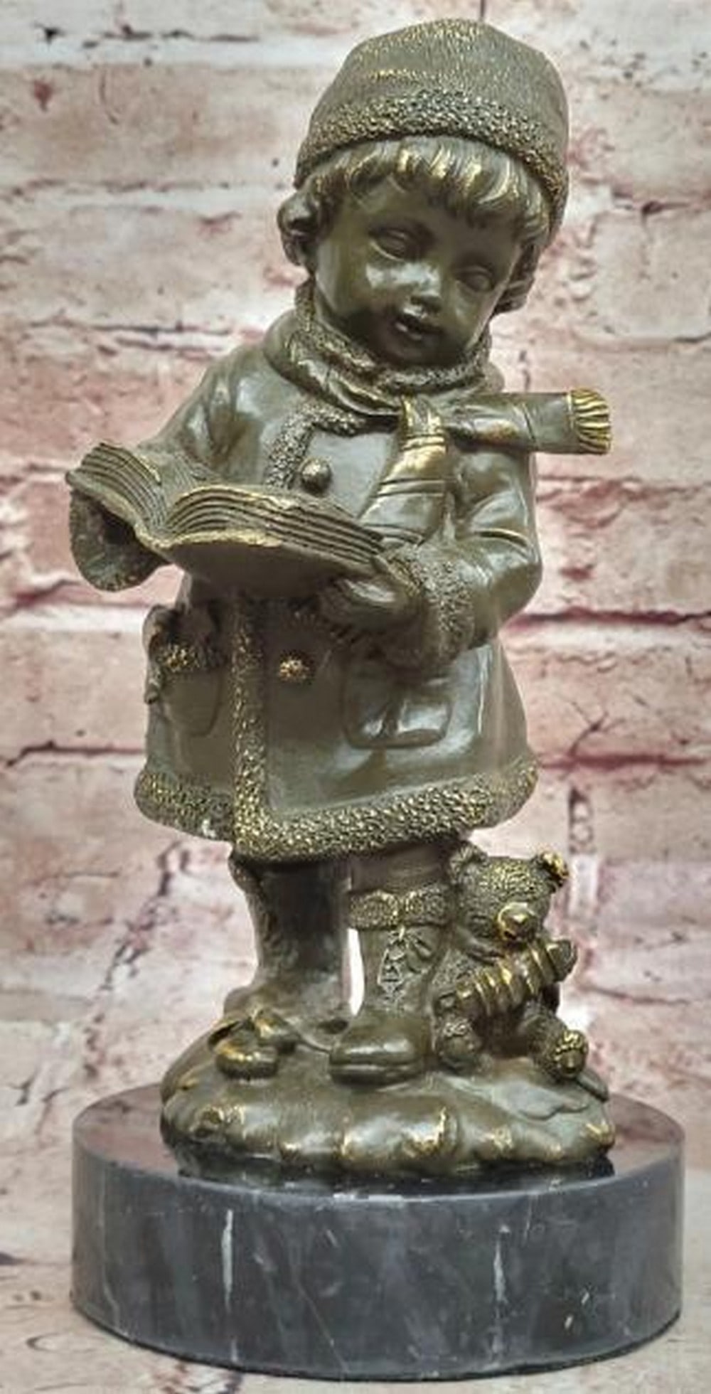 Winter Tales Bronze Sculpture: Winter Tales Bronze Sculpture A charming and heartwarming bronze sculpture capturing the innocence of childhood and the quiet joy of reading. The piece features a young child bundled in cozy winter at