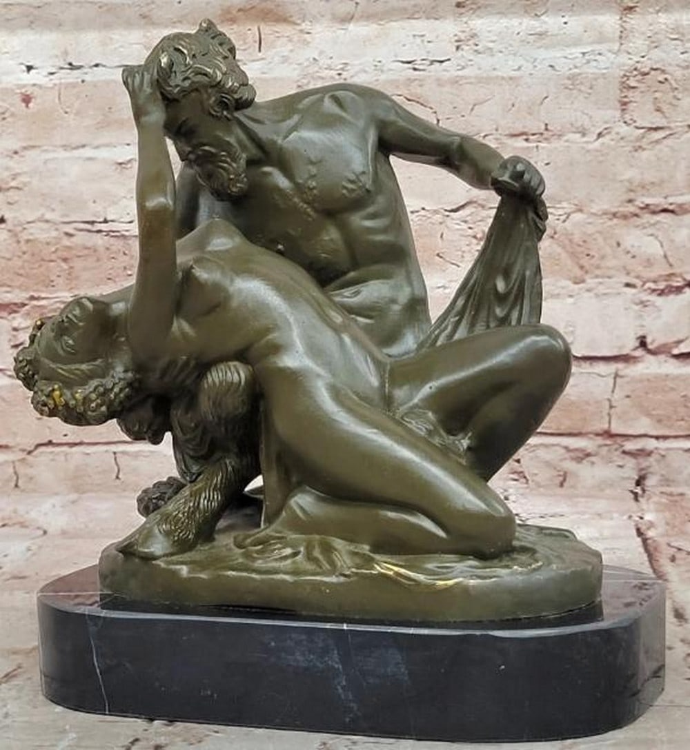 Entwined Passions Bronze Sculpture of Satyr and Nymph: Entwined Passions Bronze Sculpture of Satyr and Nymph A captivating bronze sculpture that captures the raw sensuality and mythological allure of a satyr and nymph in an intimate embrace. The nude saty