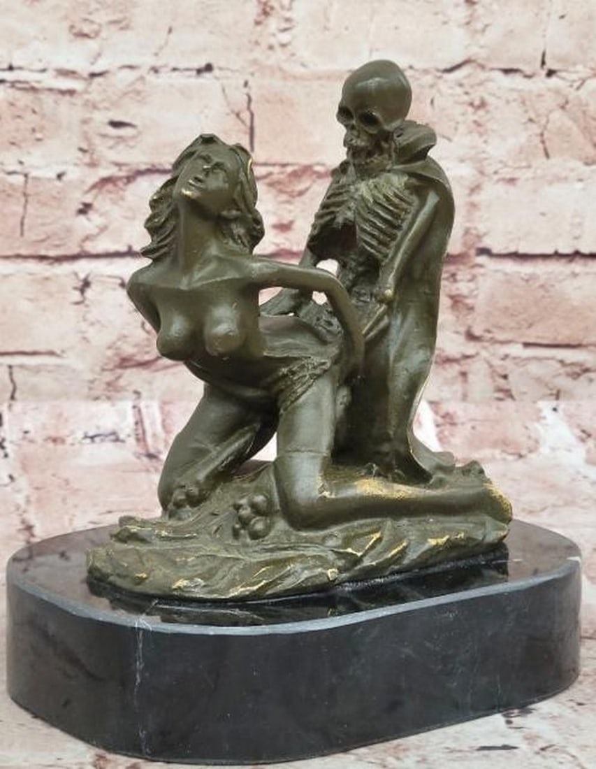 Bronze Sculpture of Woman and Skeleton: Bronze Sculpture of Woman and Skeleton A provocative and haunting reproduction bronze sculpture that delves into the intimate tension between life and death. This powerful piece depicts a nude woman l