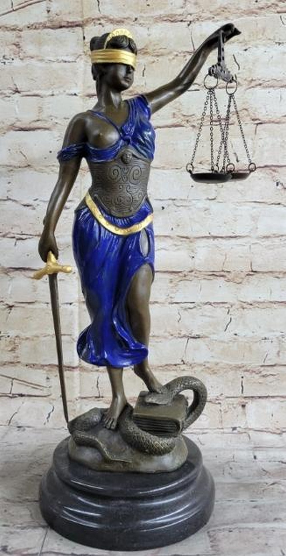Blind Justice in Blue and Gold Bronze Sculpture: Blind Justice in Blue and Gold Bronze Sculpture An elegant reproduction of the iconic Lady Justice, this hot cast bronze sculpture radiates strength and balance. Finished in a striking blue and gold p