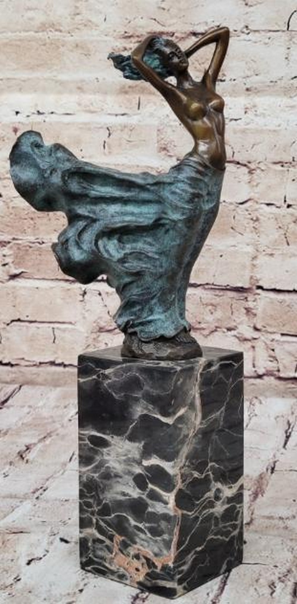 Windswept Grace Green Patina Bronze Sculpture: Windswept Grace Green Patina Bronze Sculpture This elegant bronze sculpture captures the beauty and movement of a semi-nude woman standing gracefully as her skirt billows in the wind. With both arms g