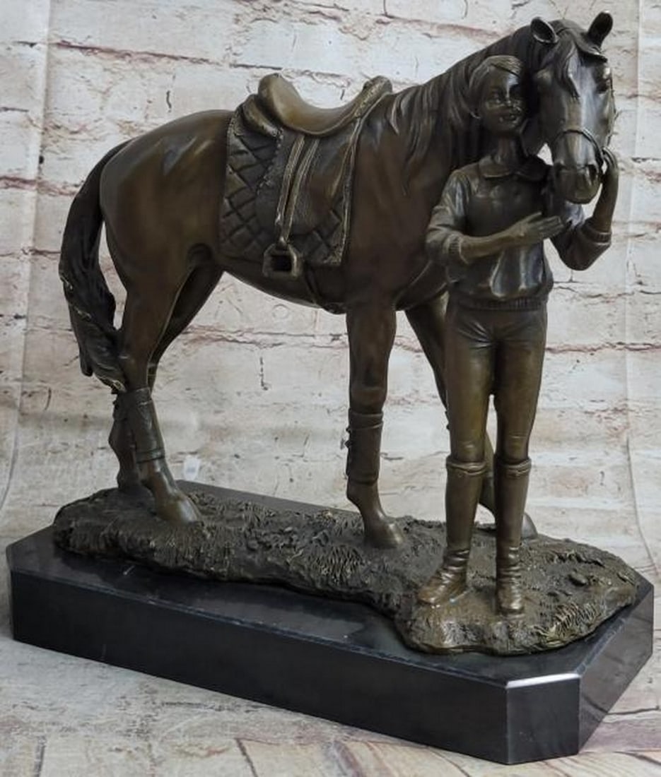 Equestrian Girl with Horse Bronze Statue: Equestrian Girl with Horse Bronze Statue This heartwarming bronze statue captures a tender and timeless moment between a young girl and her beloved horse. The little equestrian stands lovingly beside 