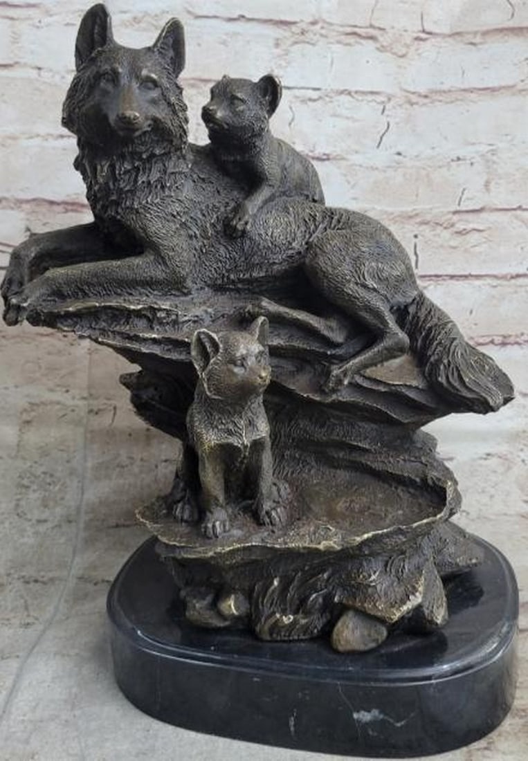 Watchful Rest: Mother Wolf and Cubs Bronze Sculpture: Watchful Rest: Mother Wolf and Cubs Bronze Sculpture This beautifully detailed reproduction bronze sculpture captures a tender family moment in the wild. A mother wolf reclines at the top of the base,
