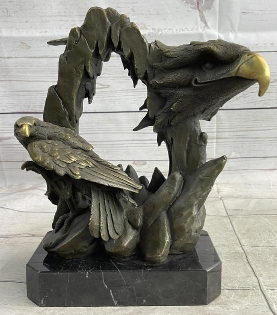 Majestic Bronze Bald Eagles on Rock Sculpture: Majestic Bronze Bald Eagles on Rock Sculpture Commanding and noble, this bronze sculpture, bearing the signature of artist Miguel Lopez, captures the spirit of the bald eagle in a powerful dual compos