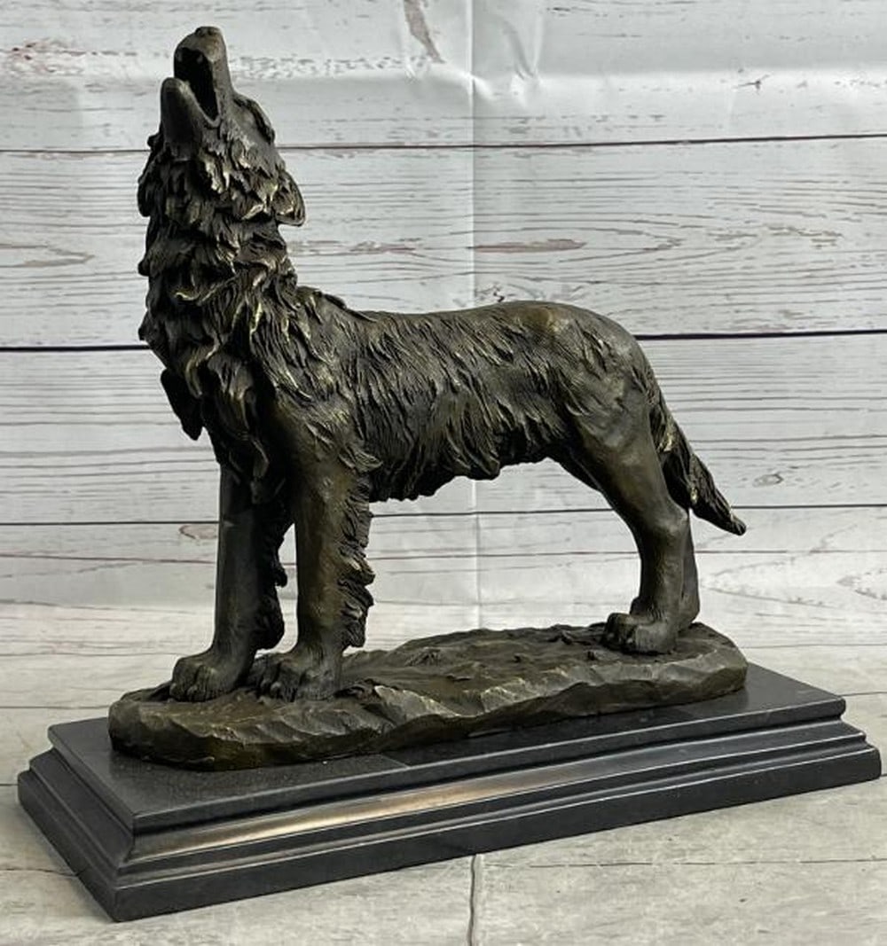 Call of the Wild Hot Cast Bronze Wolf Sculpture: Call of the Wild Hot Cast Bronze Wolf Sculpture Evoking the raw spirit of the wilderness, this hot cast bronze sculpture depicts a lone wolf mid-howl, its head raised to the sky in a powerful, timeles