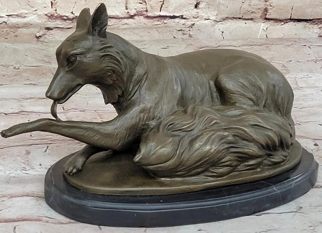 Bronze Dog Licking Paw Sculpture: Bronze Dog Licking Paw Sculpture Tender and lifelike, this bronze sculpture, bearing the signature of artist Milo, captures a serene moment of a dog laying down, gently licking its paw in a natural po