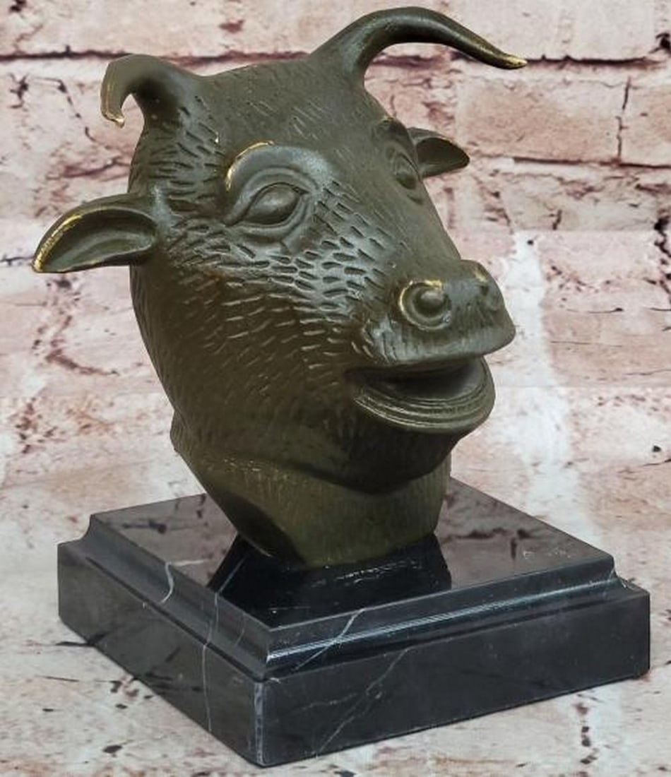 Enduring Strength: Bronze Bull Head Sculpture: Enduring Strength: Bronze Bull Head Sculpture Bold and commanding, this bronze sculpture, bearing the signature of the artist Yanez, presents the powerful head of a bull (or ox), symbolizing resilienc