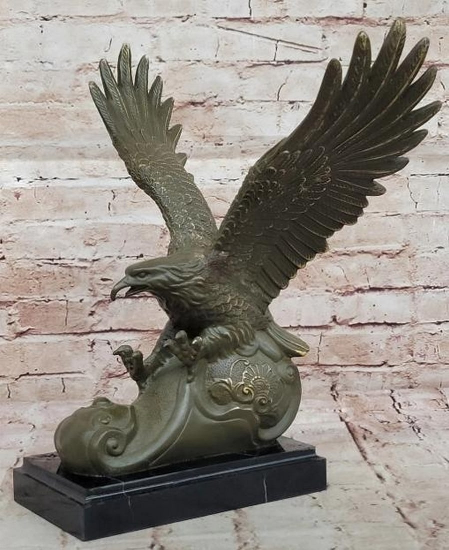 Strike of the Sky King: Bronze Eagle in Descent: Strike of the Sky King: Bronze Eagle in Descent Frozen in a moment of raw power and precision, this dynamic bronze sculpture, bearing the signature of the artist Milo, captures an eagle mid-dive with 