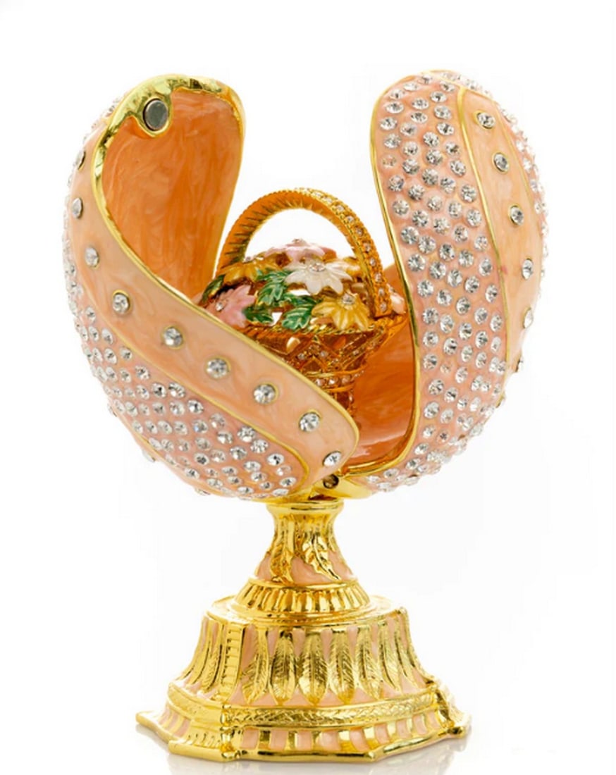 Pink Faberge Egg with Spiral Design and Floral Bouquet: Pink Faberge Egg with Spiral Design and Floral Bouquet This one-of-a-kind piece is crafted for art lovers inspired by beauty. Plated with 24K gold, it features handpicked crystals artistically placed,
