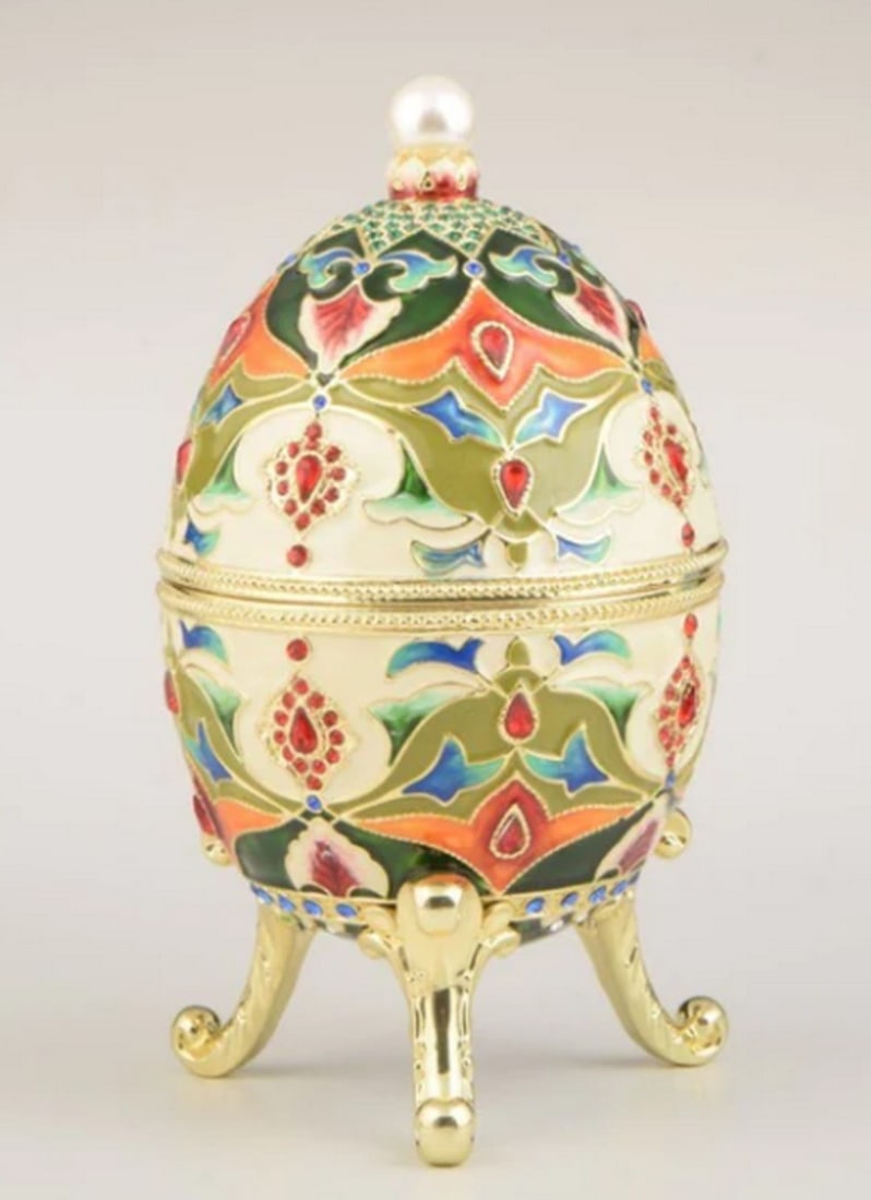 Kaleidoscopic Russian Faberge Treasure Egg: Kaleidoscopic Russian Faberge Treasure Egg Embark on a journey of cultural opulence with our Kaleidoscopic Russian Faberge Treasure Egg, a handcrafted masterpiece plated with 24K Gold. Inspired by Rus