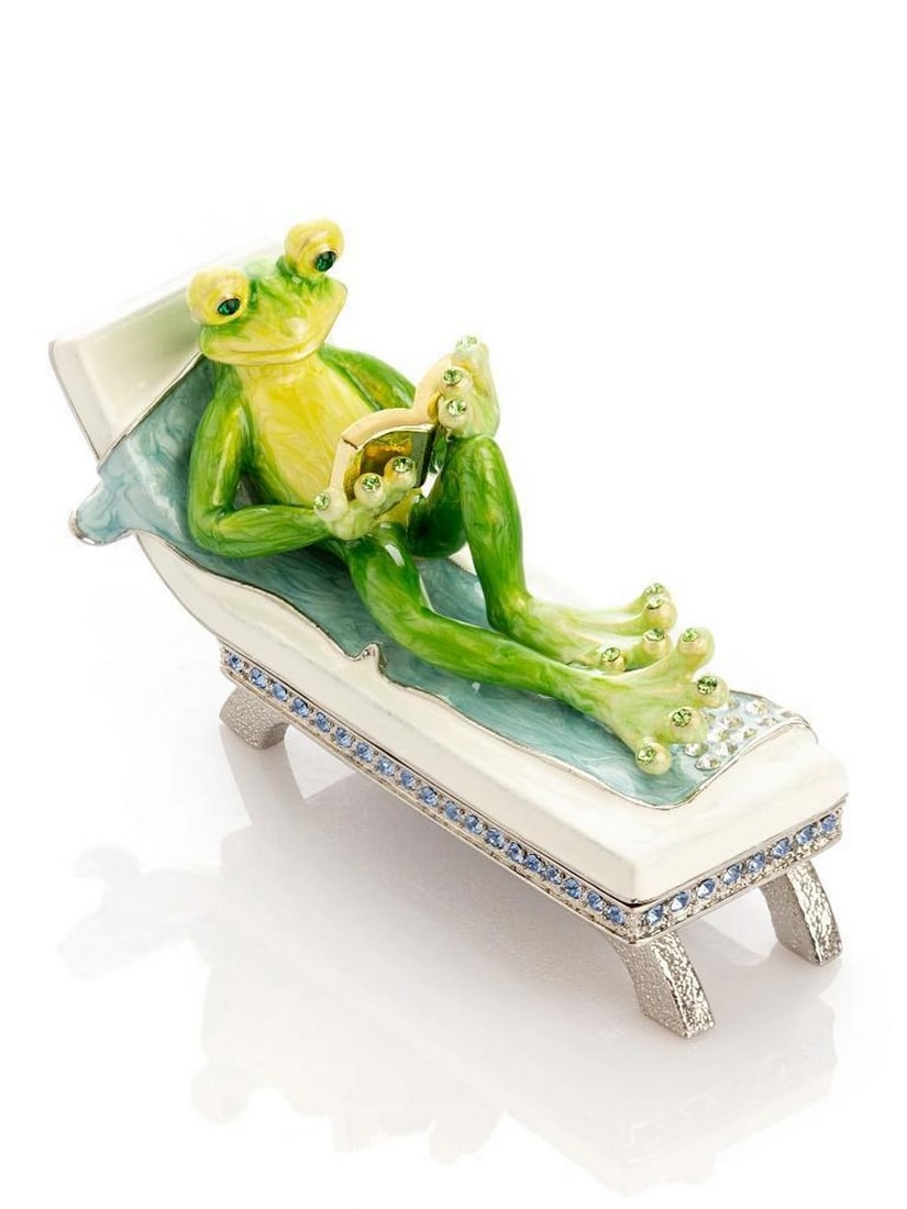 Frog on Sunbed Trinket Box 24K Gold Plated: Frog on Sunbed Trinket Box 24K Gold Plated This enamel-painted trinket box features a frog lounging on a sunbed and reading a book, handcrafted and plated with 24K gold. Austrian crystals are handpick