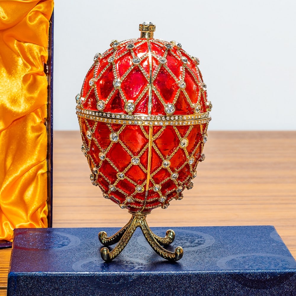 7' Royal Trellis with Crystals on Red Enamel Royal Inspired Russian Egg: 7' Royal Trellis with Crystals on Red Enamel Royal Inspired Russian Egg Enameled and jeweled, this Faberge Inspired Egg is fashioned from fine pewter and is set with genuine crystals. It mounts beauti