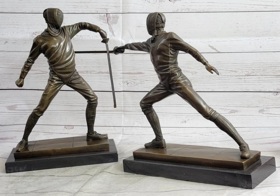 Pair Of Fencers Bronze Sculpture Bookends - 11" x 18": Pair Of Fencers Bronze Sculpture Bookends - 11" x 18" Presenting a captivating pair of bronze sculptures that beautifully capture the intensity and grace of fencers in action. The dynamic scen