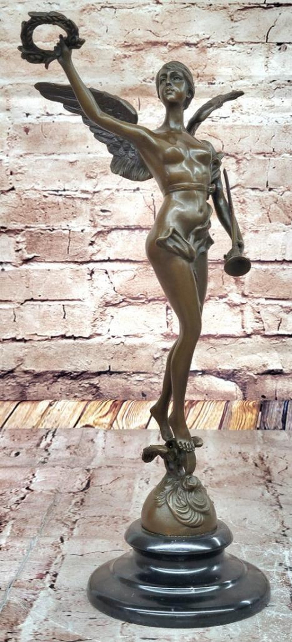 Angel with Laurel Wreath" Bronze Sculpture Inspired by Antoine Bofill - 14.5" x 7.5: "Angel with Laurel Wreath" Bronze Sculpture Inspired by Antoine Bofill - 14.5" x 7.5" This exquisite bronze sculpture depicts an angel gracefully carrying a laurel wreath, a symbol of 