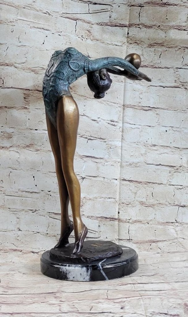 Acrobatic Gymnast Demonstrating Her Skills Bronze Sculpture: Acrobatic Gymnast Demonstrating Her Skills Bronze Sculpture Acrobatic Gymnast Demonstrating Her Skills Bronze Sculpture The rhythmic gymnast. Captured in the midst of her ball routine, she flaunts her